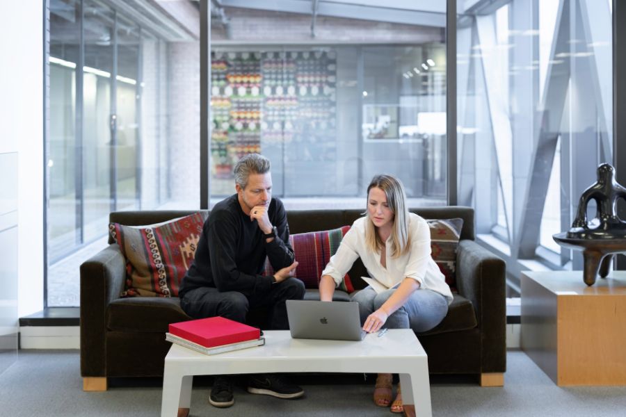 Real estate agent showing client a listing