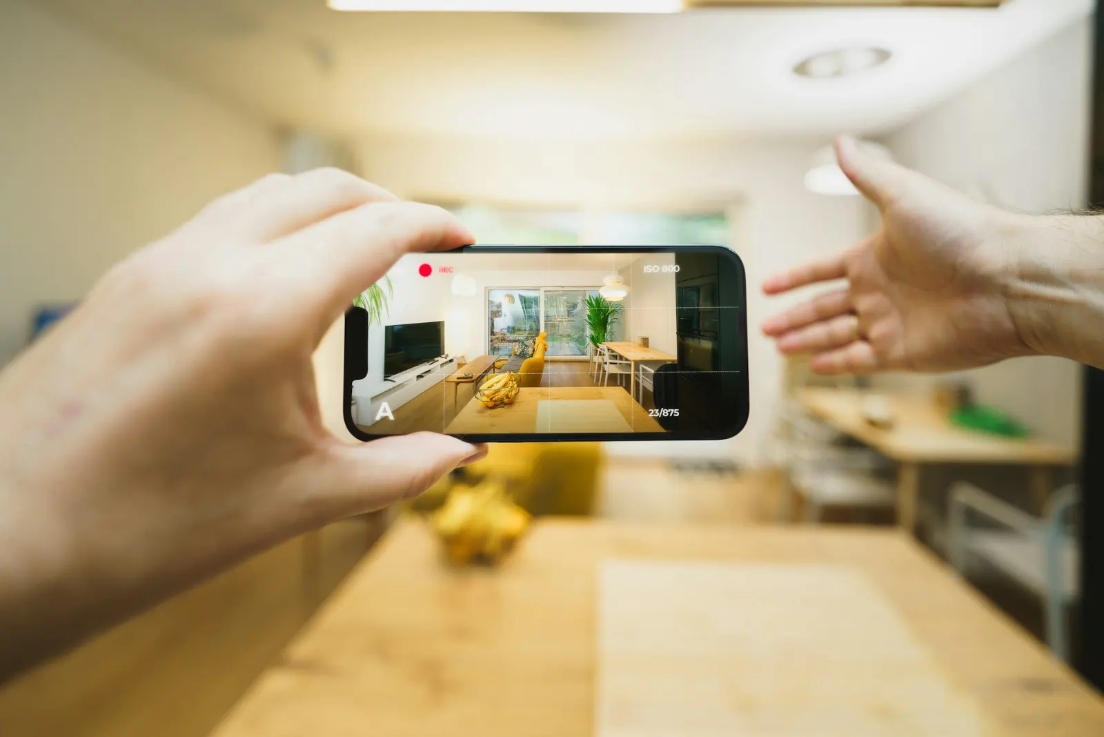 Cell phone filming the inside of a house