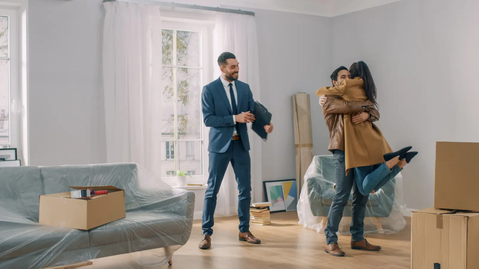 real estate agent with a happy couple