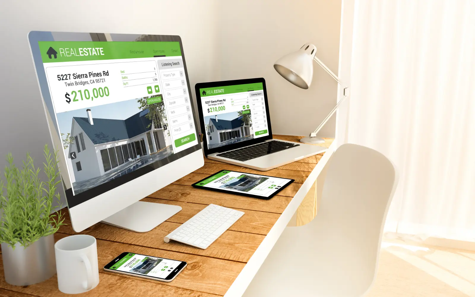Responsive real estate website displayed across desktop, laptop, tablet and mobile devices