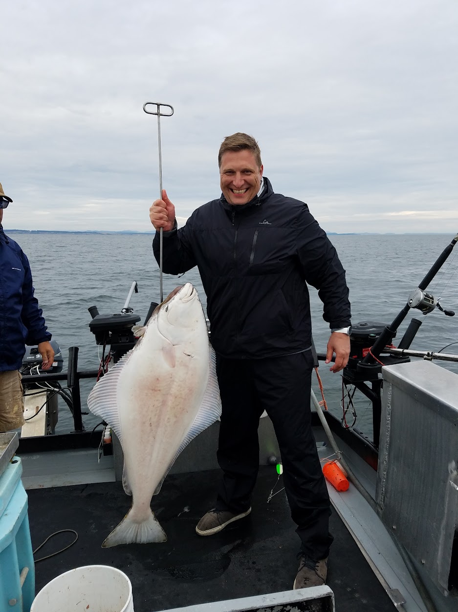 Jason Fox with a halibut in the Pacific Northwest
